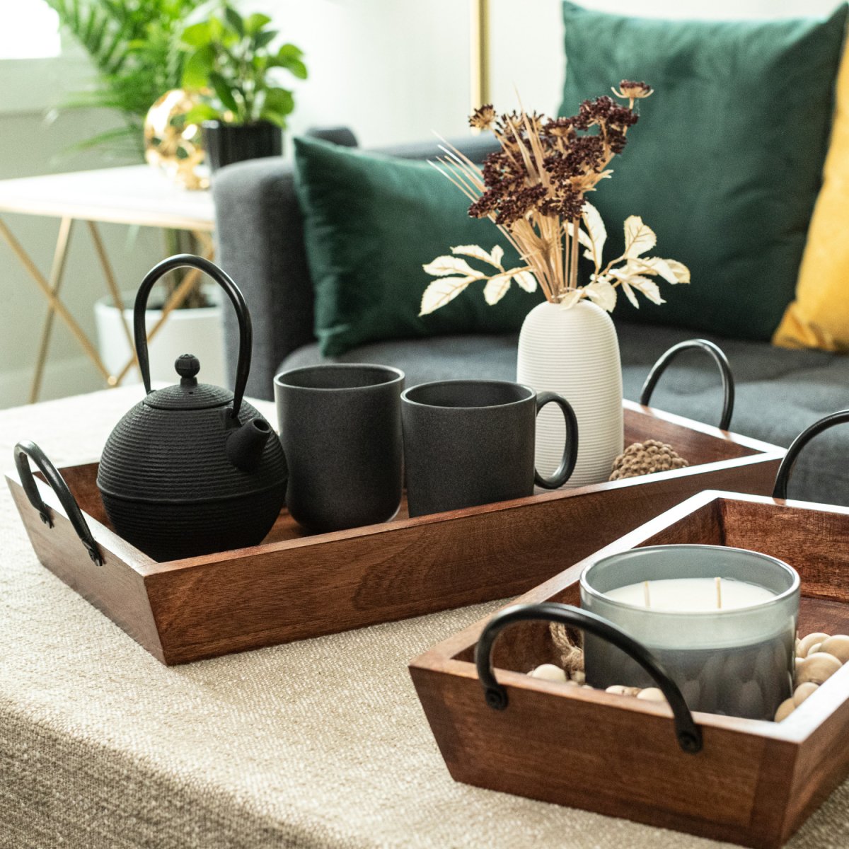 Rectangular Wooden Serving Trays with Black Metal Handles, Set of 2, lifestyle image with the trays on a coffee table- Aesthetic Living