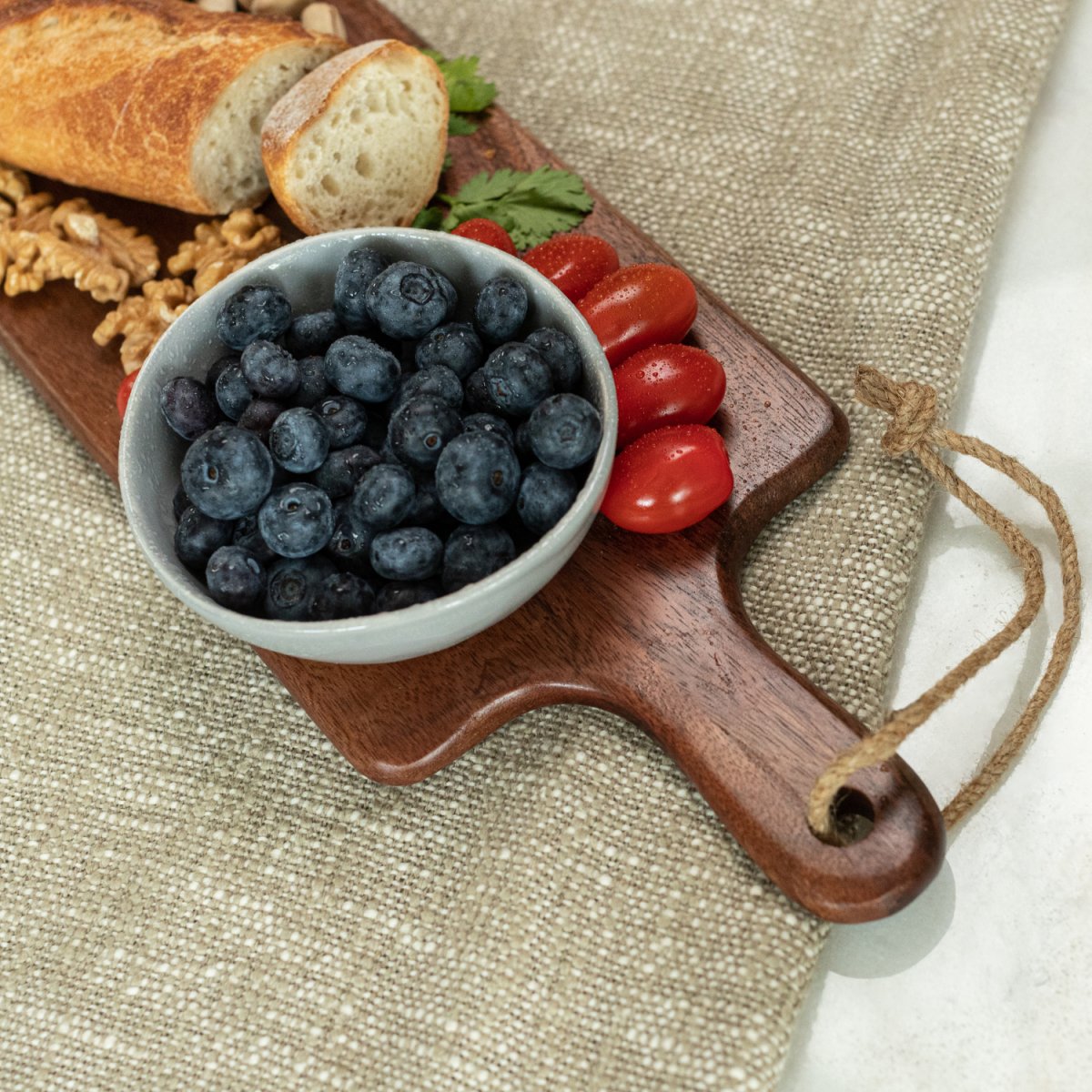 Long Mango Wood Charcuterie Board_Handle Close-up - Aesthetic Living