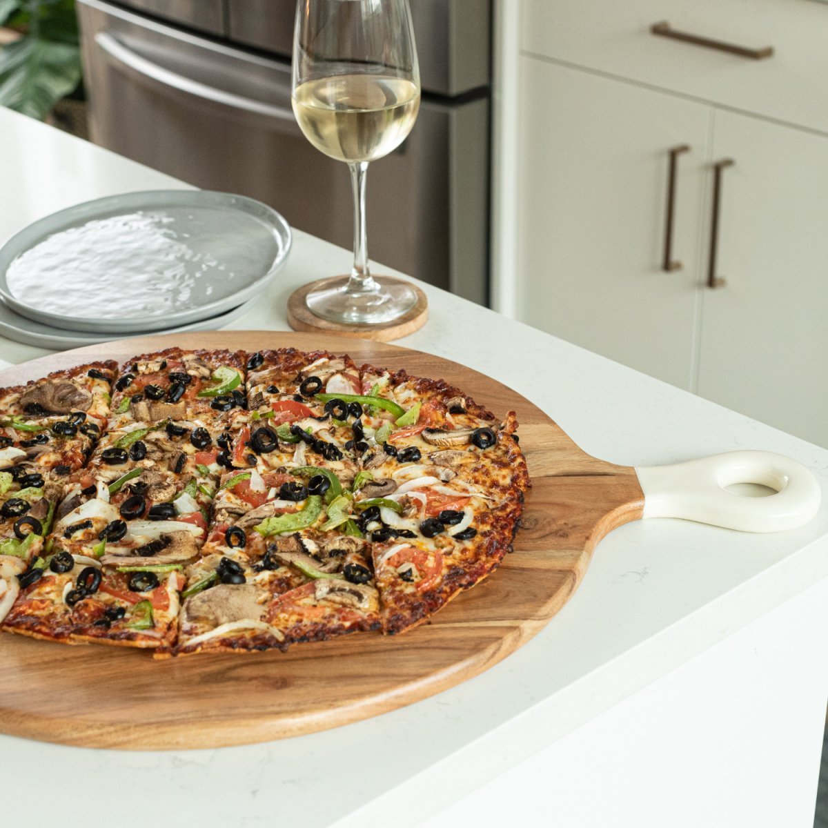 Pizza Peel Shaped Round Pizza Paddle Charcuterie Board with White Enamel Handles side image- Aesthetic Living