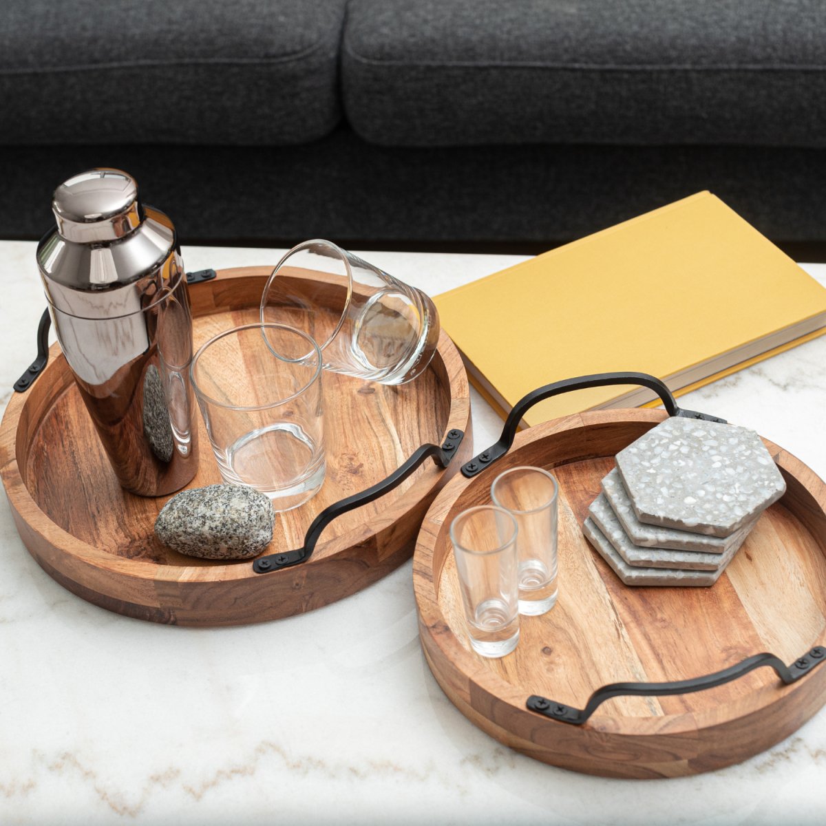 Round Wooden Serving Trays with Black Metal Handles, set of 2 lifestyle image with bar accessories top shot- Aesthetic Living