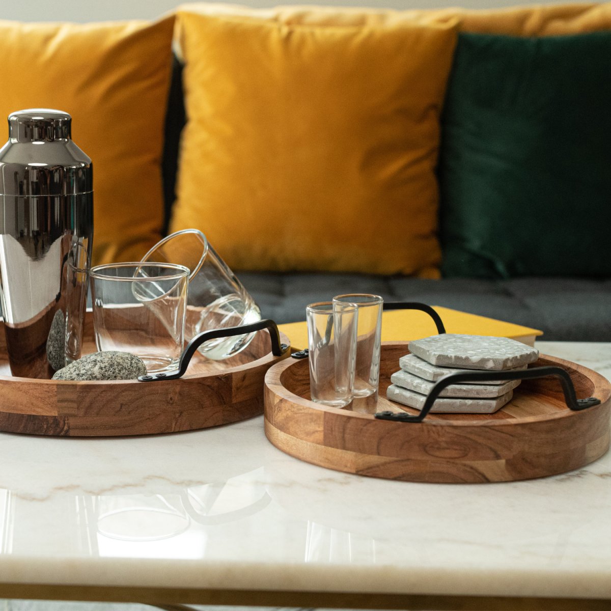 Round Wooden Serving Trays with Black Metal Handles, set of 2 lifestyle image with bar accessories side shot - Aesthetic Living