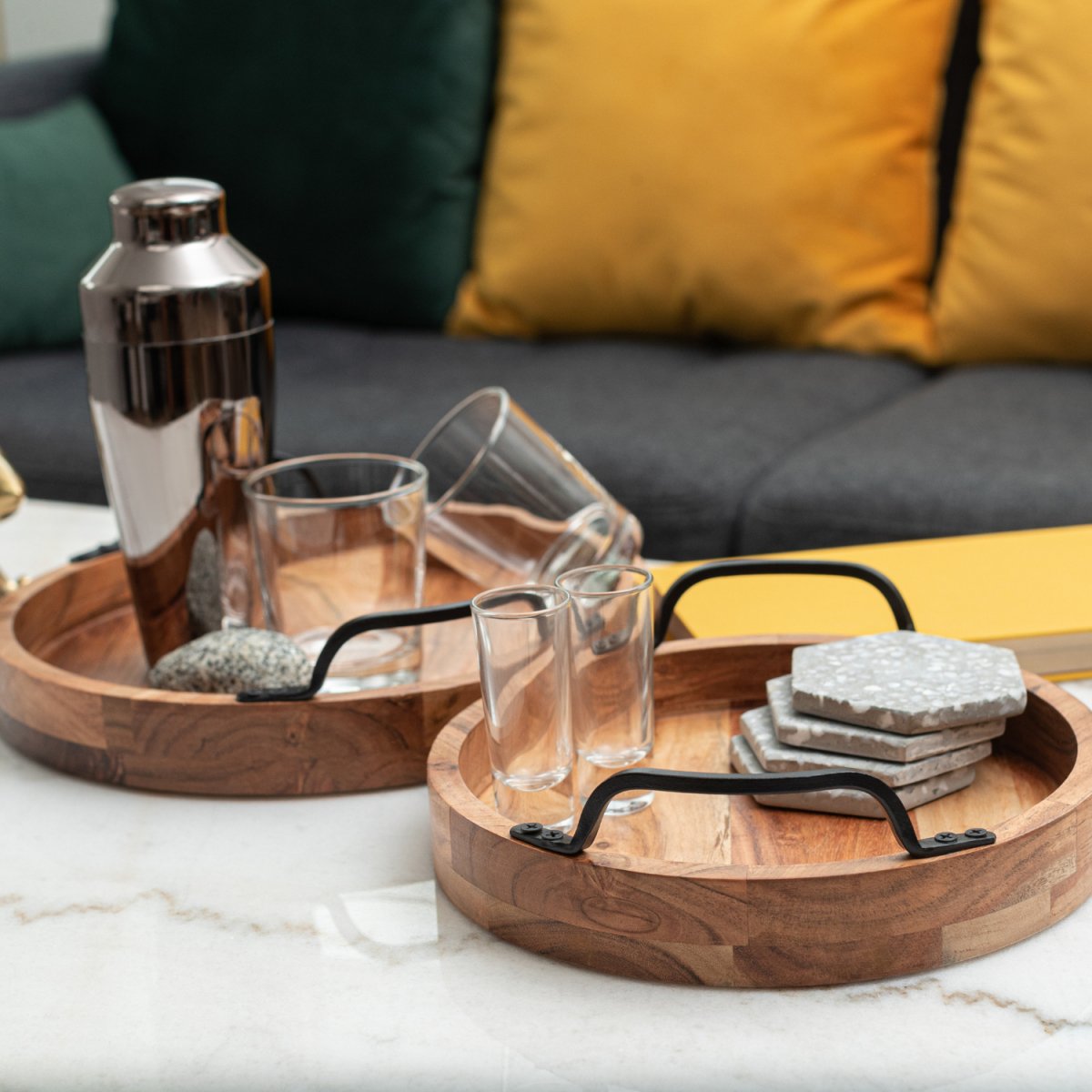 Round Wooden Serving Trays with Black Metal Handles, set of 2 lifestyle image with bar accessories - Aesthetic Living
