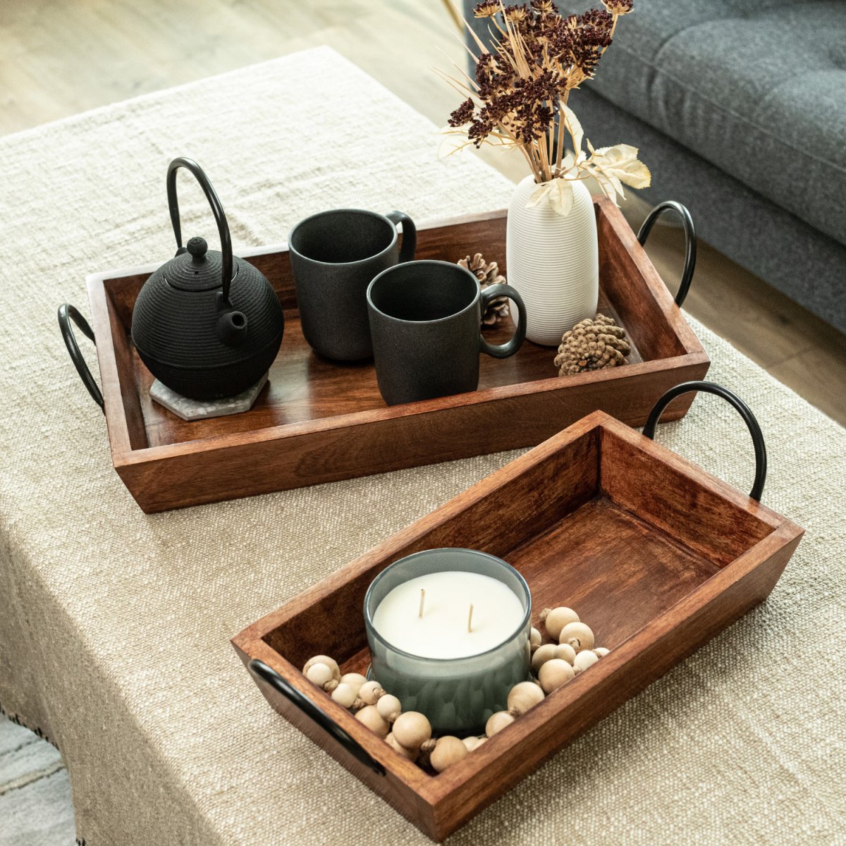 Rectangular Wooden Serving Trays with Black Metal Handles, Set of 2 on a coffee table - Aesthetic Living